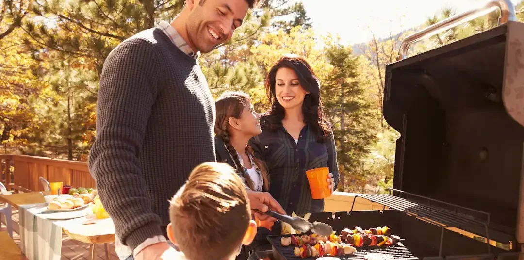 Picture of a family cooking outside for a pest control ad in North Carolina.