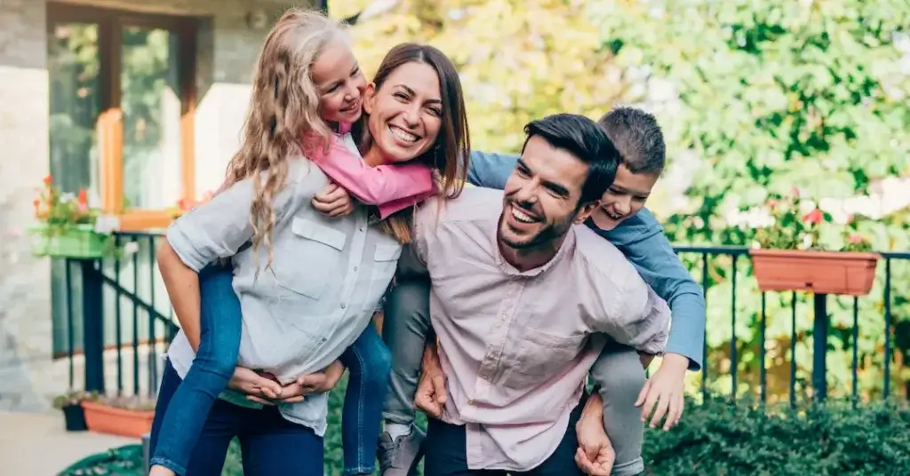 A family playing outside after hiring outdoor pest control services in North Carolina.